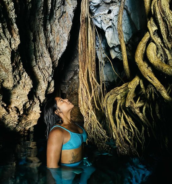 ela radiante diante de uma paisagem deslumbrante — possivelmente durante sua passagem pelo Jalapão.